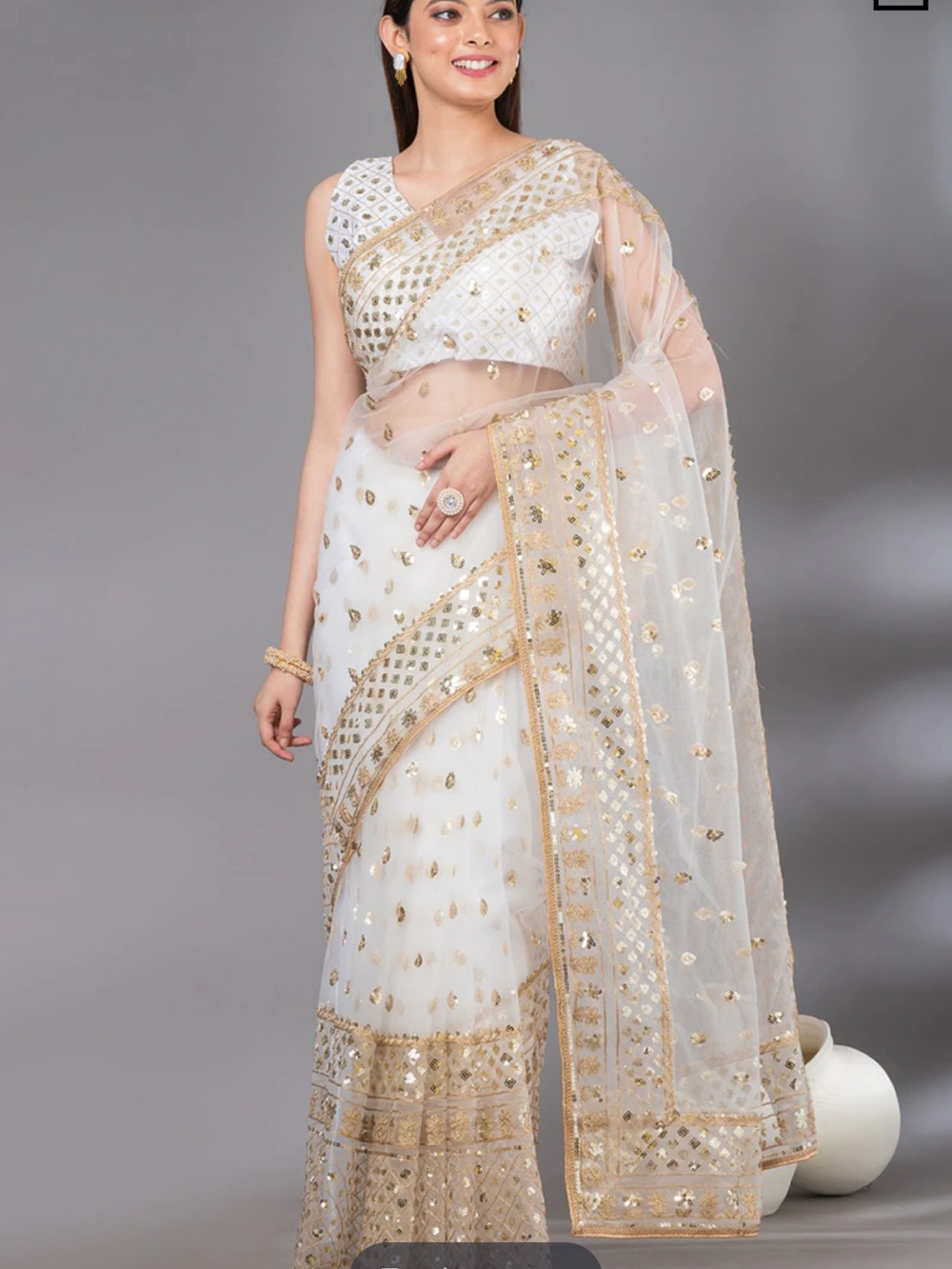 Elegant White and Gold Embellished Saree